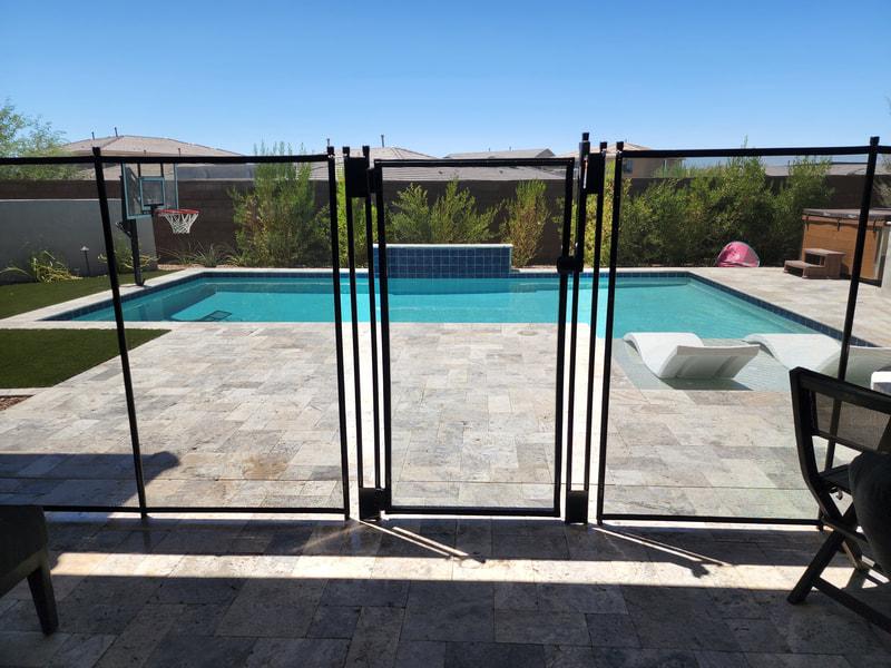 residential swimming pool with safety fencing around a backyard in British Columbia