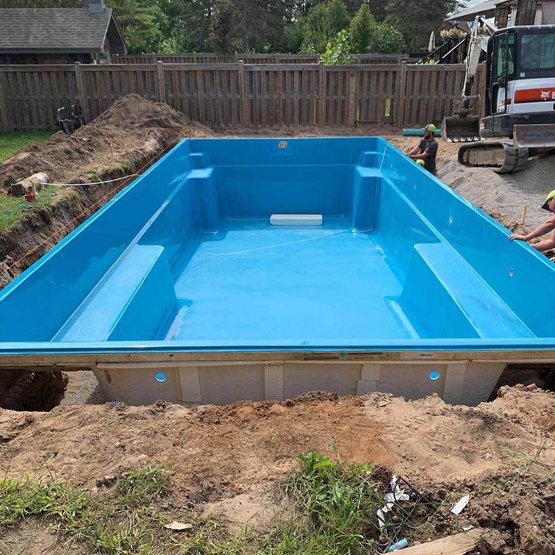 Backyard excavation and site preparation for a fibreglass pool installation